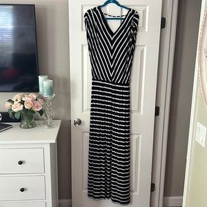 Black and white striped V-neck long maxi dress with slit up the side